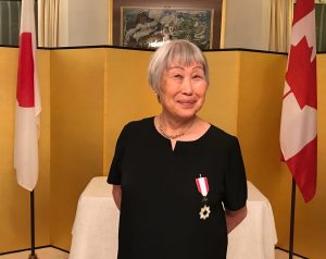 MMe Kazuko Tanaka was decorated with the Order of the Rising Sun, gold ansd